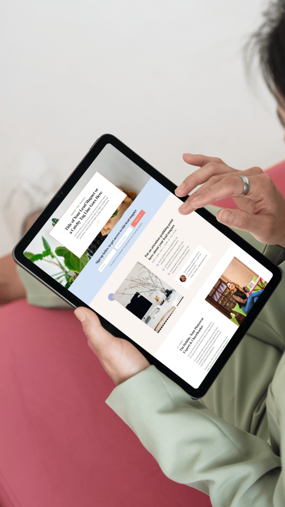 Mockup of a freebie sign up page in a tablet held by a woman